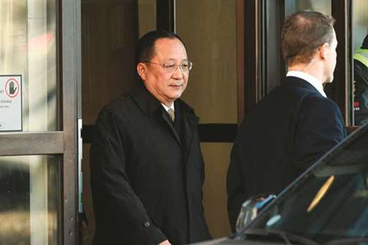 North Korean Foreign Minister Ri Yong Ho (left) leaves the Swedish government building Rosenbad in central Stockholm yesterday.
