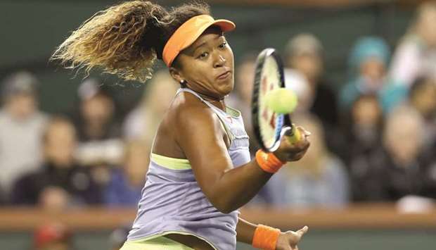 Naomi Osaka whips a forehand en route to her win over Simona Halep in the semi-finals of the BNP Paribas Open in Indian Wells, California. (AFP)