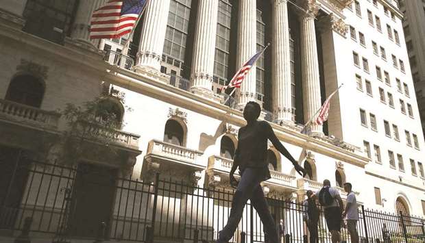 People walk by the New York Stock Exchange (file). For the third week in a row, the S&P 500 Index reversed some or all of the prior weeku2019s performance.