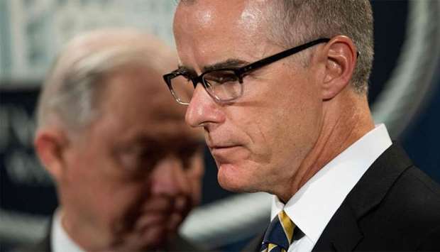 Acting Director of the Federal Bureau of Investigation (FBI) Andrew McCabe (R) and US Attorney General Jeff Sessions (L)