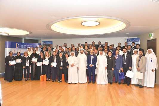Doha Banku2019s long-serving employees during the awarding ceremony.