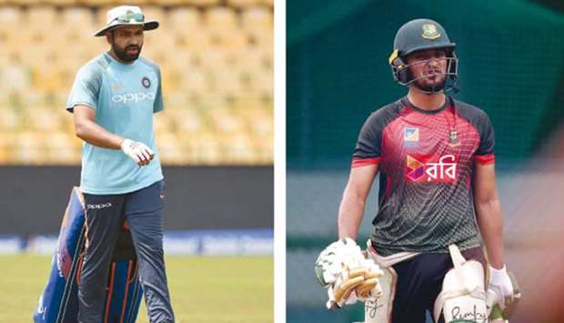 India captain Rohit Sharma and his Bangladeshi counterpart Shakib Al Hasan at the nets in Colombo yesterday.