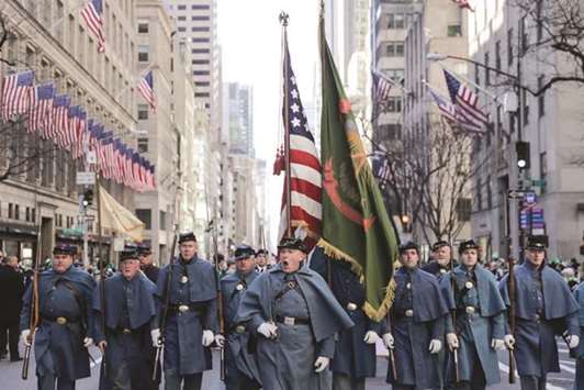Participants march during the St Patricku2019s Day parade in New York City yesterday.