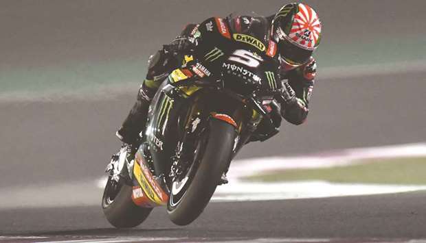 Johann Zarco in action during his  record-breaking effort at the Losail  International Circuit yesterday. Inset, he celebrates with his teammates. PICTURES: Noushad Thekkayil