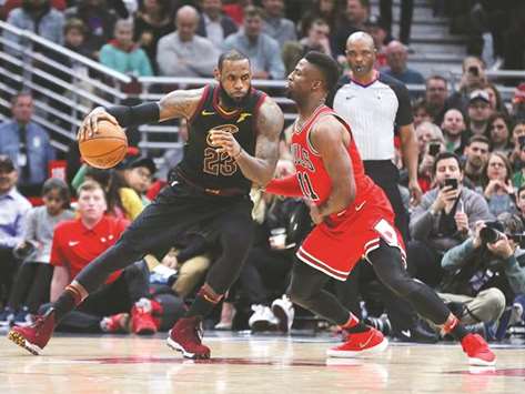 Cleveland Cavaliers forward LeBron James (left) controls the ball as Chicago Bulls forward David Nwaba defends during the NBA game in Chicago. (USA TODAY Sports)