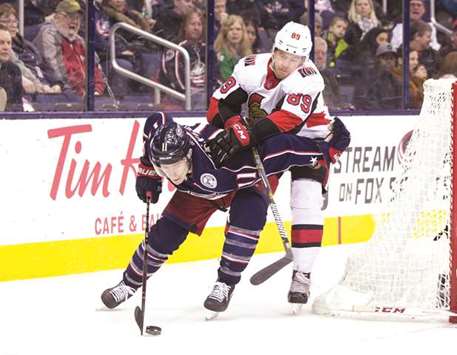Ottawa Senators left wing Max McCormick (right) hits Columbus Blue Jackets left wing Matt Calvert as he skates behind the net during NHL game. (USA TODAY Sports)