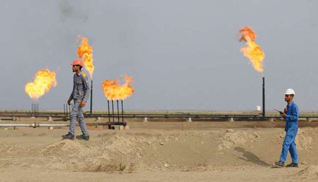 Iraqi labourers work at an oil refinery in the southern town of Nasiriyah (file). Iraq is seeking to sign joint ventures with companies from China, India, Japan and South Korea to help target Asian markets.