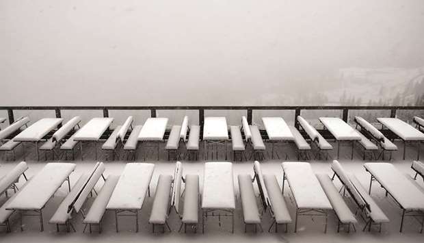 SNOWFALL: Seating as part of an Alpine cable car station in the Bavarian Alps is covered in fresh snow.