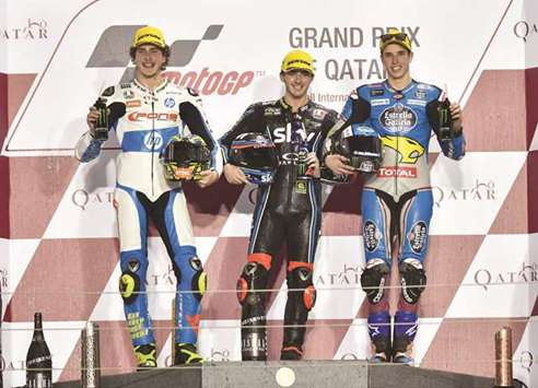 Moto2 winner Francesco Bagnaia (C) poses with runner-up Lorenzo Baldassarri (L) and third placed Alex Marquez after the Moto2 race during the Motorcycling Grand Prix of Qatar at the Losail International Circuit yesterday. PICTURE: Noushad Thekkayil
