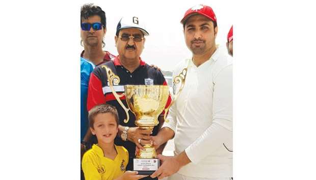 Khetco captain (right) receives winneru2019s trophy from QCAu2019s head of domestic cricket Gul Khan Jadoun.