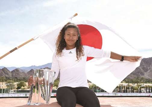 Naomi Osaka of Japan poses with the championship trophy after defeating Daria Kasatkina of Russia in the final of BNP Paribas Open in Indian Wells, California. (AFP)