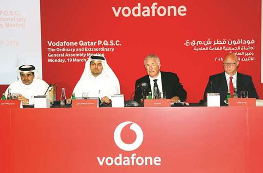 Gray (second right) flanked by Vodafone Qatar board member Nasser al-Marri; Sheikh Hamad and CFO Brett Goschen at the firmu2019s ordinary and extraordinary general assembly meetings at the Four Seasons yesterday. PICTURE: Jayaram
