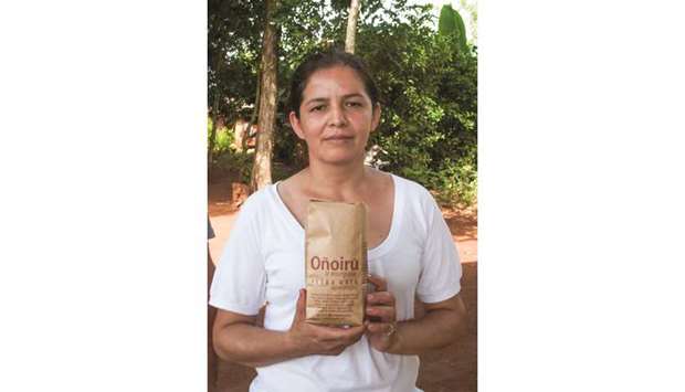 POPULAR: A Paraguayan peasant woman holds a packet of organic yerba mate. Traditionally produced versions of the herb are becoming increasingly popular.