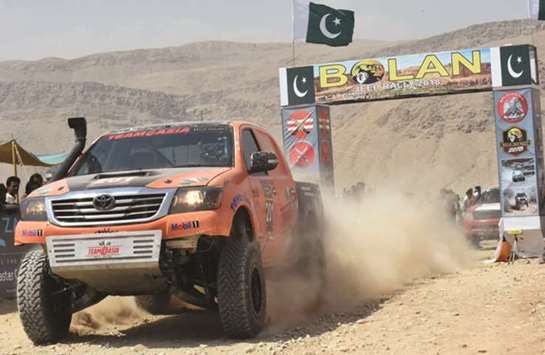 A driver powers his vehicle during the Jeep Rally in Baluchistanu2019s Bolan district yesterday. More than 50 drivers participated in Jeep Rally organised by Pakistanu2019s army.