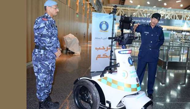 Brigadier Eissa Arrar al-Romaihi and Major Ali Rashid explaining the features of the new device.