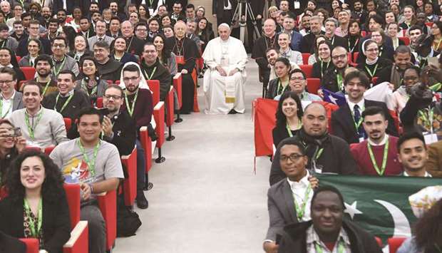 Pope Francis with students yesterday during a pre-synodal meeting at Collegio Maria Mater Ecclesiae in Rome.