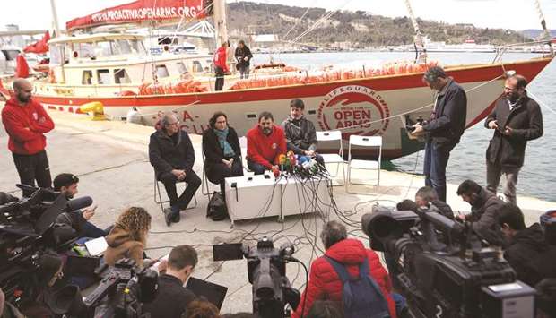 The founder of the Spanish NGO Proactiva Open Arms, Oscar Camps (second right) gives a press conference yesterday with Spanish singer Joan Manuel Serrat (left), Barcelona Mayor Ada Colau, and Spanish former basketball player Jordi Villacampa at Barcelonau2019s harbour.