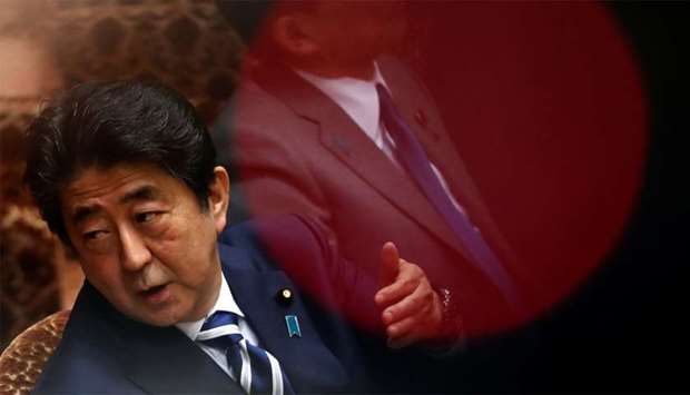 Japan's Prime Minister Shinzo Abe attend an upper house parliamentary session in Tokyo