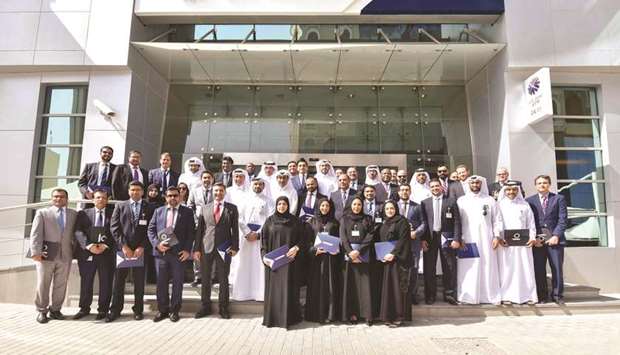 Some of the QNB employees who participated in the Leadership and Management Development Programme seen with bank officials.