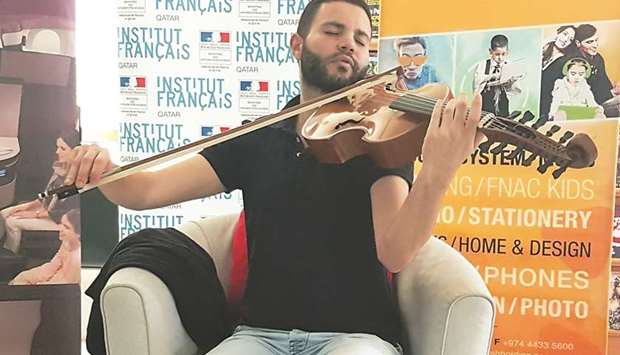 Jasser Haj Youssef plays with his musical instrument at the French Institute in Qatar yesterday. PICTURE: Joey Aguilar