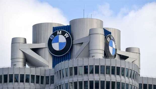The BMW logo is seen on top of the headquarters of German carmaker in Munich.