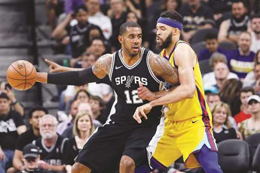 San Antonio Spurs power forward LaMarcus Aldridge (No 12) and Golden State Warriors centre JaVale McGee in action during the second half of their NBA game at AT&T Centre. PICTURE: USA TODAY Sports