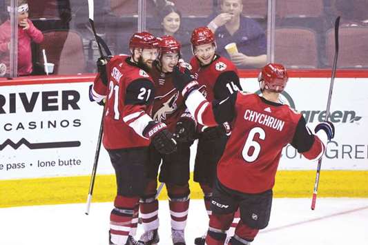 Arizona Coyotes right wing Richard Panik celebrates with Clayton Keller, Derek Stepan and Jakob Chychrun after scoring a goal in the second period against the Calgary Flames at Gila River Arena. PICTURE: USA TODAY Sports