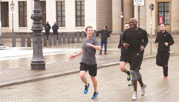 Mark Zuckerberg running through Berlin with his bodyguards in 2016.