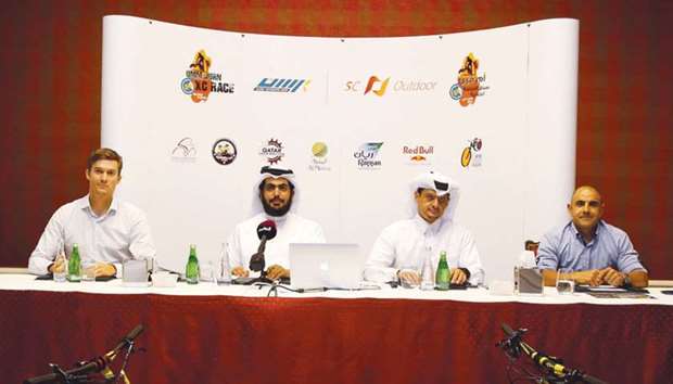 Rasen Sportsu2019 Sheikh Abdullah al-Thani (second left) addresses the media in Doha yesterday.