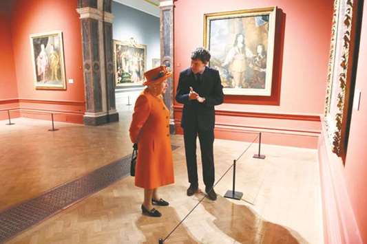 Queen Elizabeth II talks with curator Per Rumberg during her visit to the Royal Academy of Arts in London yesterday. The Royal Academy of Arts has completed a major redevelopment of its galleries for the academyu2019s 250th anniversary year. During the course of the visit, the Queen also had an opportunity to view the Royal Academyu2019s current exhibition u2018Charles I: King and Collectoru2019.
