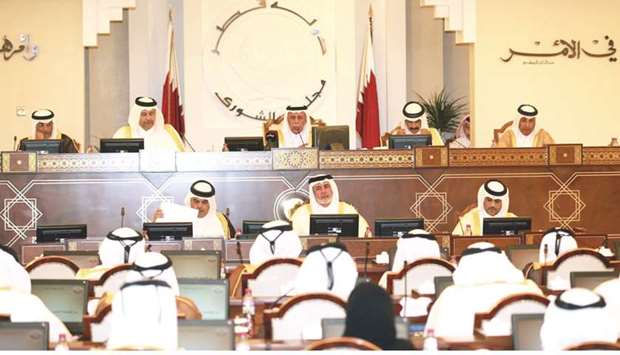 HE the Speaker Ahmed bin Abdullah bin Zaid al-Mahmoud presiding over an Advisory Council meeting, attended by HE the Minister of Economy and Commerce Sheikh Ahmed bin Jassim bin Mohammed al-Thani.