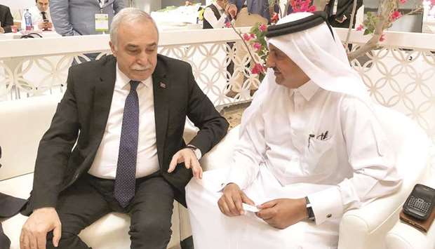 Qatar Chamber chairman Sheikh Khalifa bin Jassim al-Thani in a huddle with Turkeyu2019s Minister of Agriculture and Livestock Ahmed Ashraf Faqi Baba at the Turkish pavilion at AgriteQ 2018.