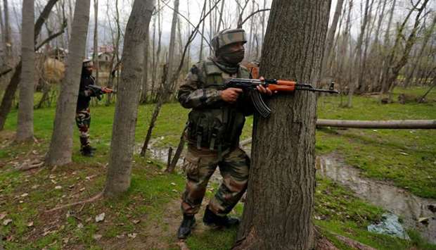 Indian Army soldiers take their positions near the site of a gunbattle on the outskirts of Srinagar. March 15, 2018 file picture.