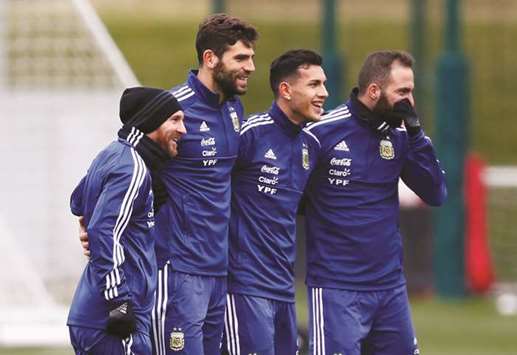 Argentinau2019s Lionel Messi, Federico Fazio, Leandro Paredes and Gonzalo Higuain during a training session in Manchester yesterday. (Reuters)