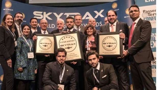 Al-Meer with Hamad International Airport team following HIA's ranking as the u20185th best airport in the worldu2019 at the Skytrax World Airport Awards 2018, which took place in Stockholm, Sweden.