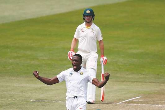 In this file photo taken on March 2, South African bowler Kagiso Rabada celebrates after taking the wicket of unseen Australian batsman Tim Paine.