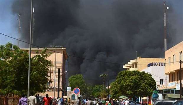 Black smoke rises as the capital of Burkina Faso came under multiple attacks on Friday.