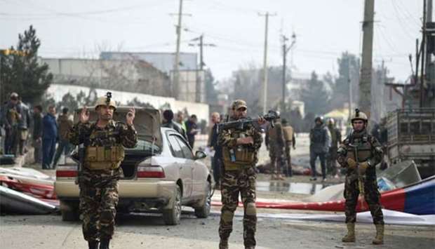Afghan security personnel pictured at the site of a bombing in Kabul on Friday.