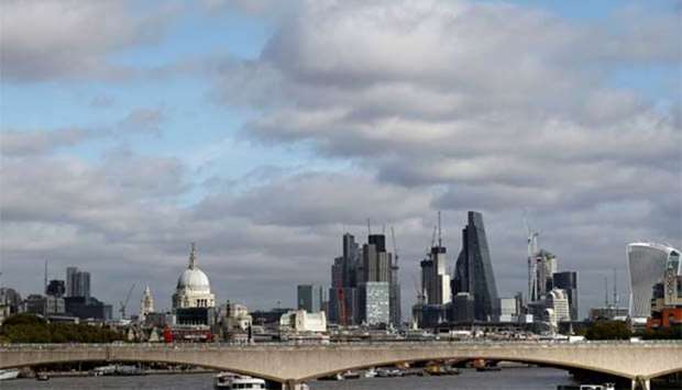 Buildings in the City of London are seen behind Waterloo Bridge. London property has attracted foreign buyers.