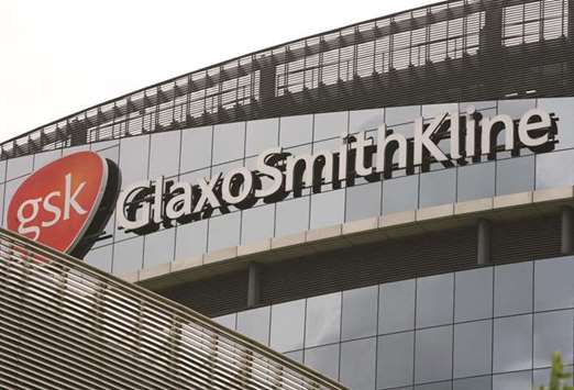 The Glaxosmithkline logo is seen at the companyu2019s UK headquarters in Brentford, England. Sources said GSK was working on an offer to buy Pfizeru2019s consumer healthcare business.