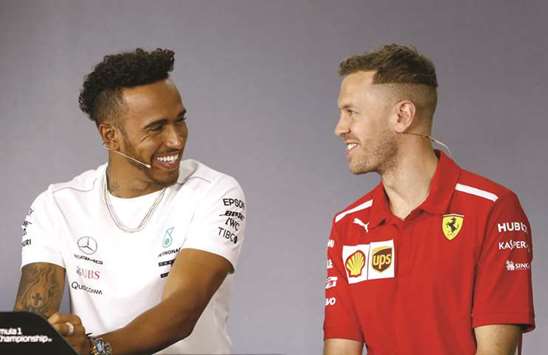 Mercedesu2019 Lewis Hamilton (L) and Ferrariu2019s Sebastian Vettel during a press conference in Melbourne yesterday.