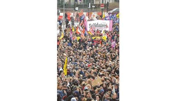 People take part in a demonstration during a nation-wide action day of French civil servants against governmentu2019s reform plans in Nantes, western France, yesterday.