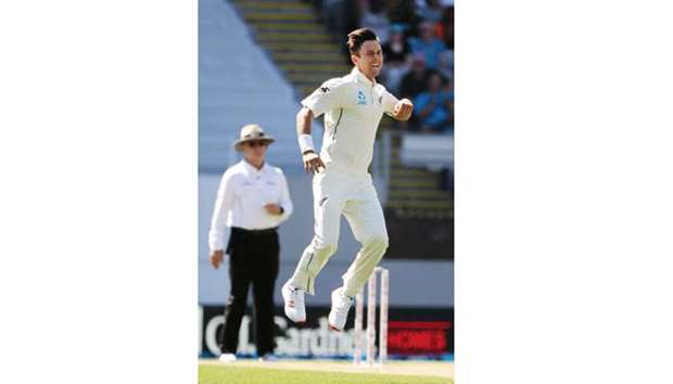 Trent Boult of New Zealand reacts after bowling Alastair Cook of England during the first day of the day-night Test at Eden Park in Auckland yesterday