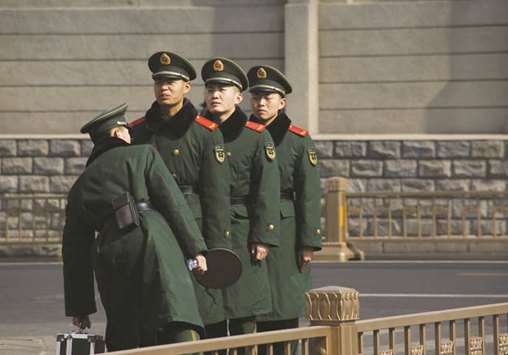 Paramilitary police officers patrol ahead of the plenary session of National Peopleu2019s Congress in Beijing.