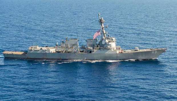 The officials said the USS Mustin traveled close to Mischief Reef in the Spratly Islands