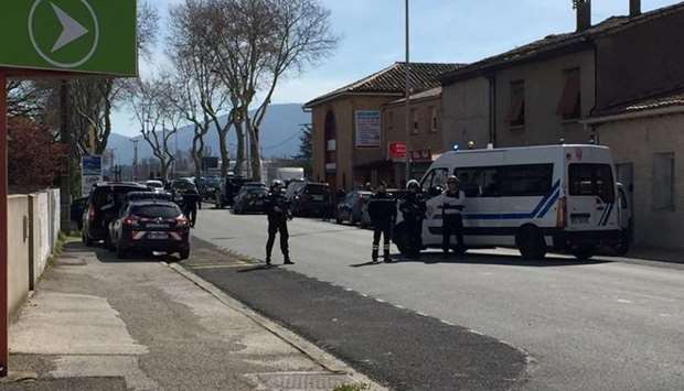 Police are seen at the scene of a hostage situation in a supermarket in Trebes, Aude.  At least one person was killed when a man took hostages in a supermarket in the southwestern French town of Trebes on Friday, the mayor told BFM TV.