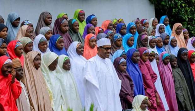 Nigeria's President Muhammadu Buhari meets with some of the released Dapchi schoolgirls in Abuja on Friday.
