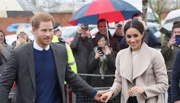 Prince Harry and Meghan Markle are pictured during a visit to Belfast on Friday.