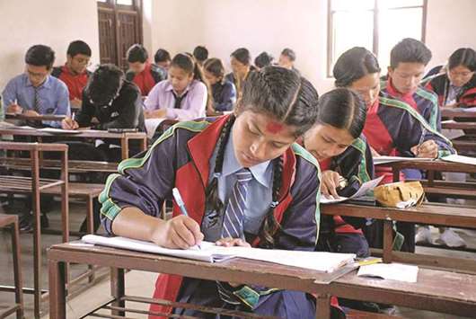Students taking secondary education examination at a school in Kathmandu.