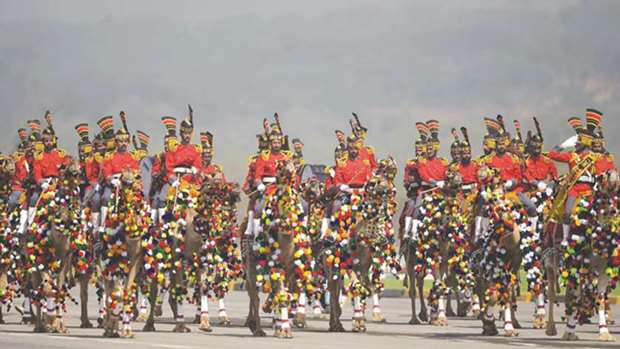 A camel-mounted military band performs yesterday during the Pakistan Day parade in Islamabad.